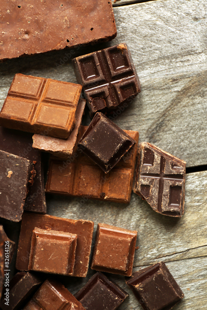 Set of chocolate on wooden table, closeup Set of chocolate on wooden table, closeup