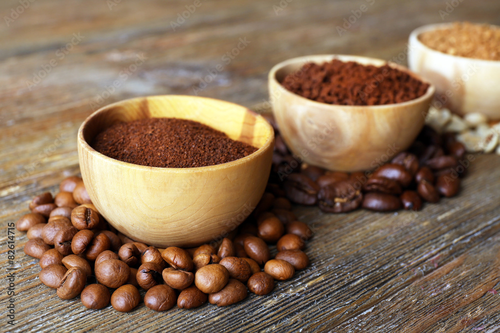 Various of coffee in small dishes on wooden background Various of coffee in small dishes on wooden background