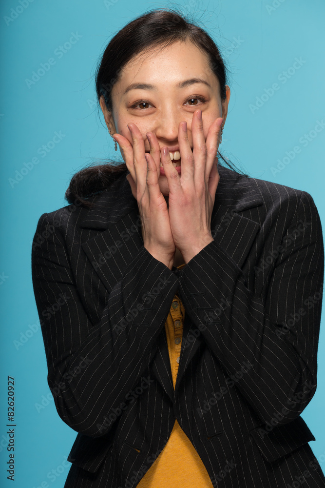 Young Asian woman in studio surprised reaction face Young Asian woman in studio surprised reaction face