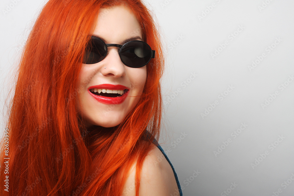 Young surprised woman wearing sunglasses. Young surprised woman wearing sunglasses.