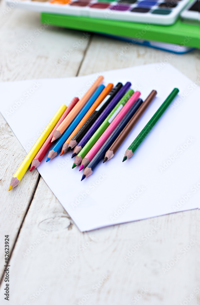 Colored pencils and paper on the desk