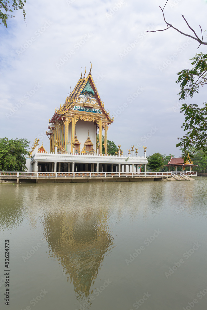 Temple with canal and sky background at Wat NaTangNok