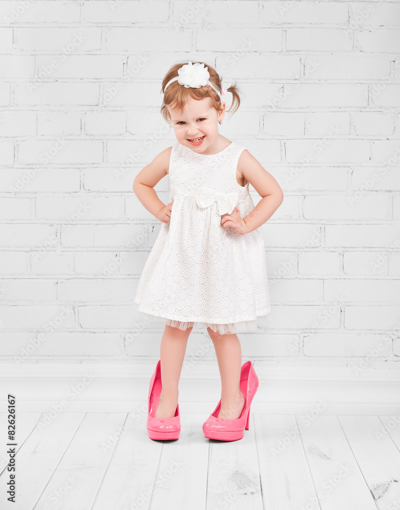 little girl fashionista in big pink heeled shoes little girl fashionista in big pink heeled shoes