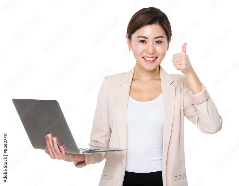 Businesswoman use of laptop computer and thumb up Businesswoman use of laptop computer and thumb up