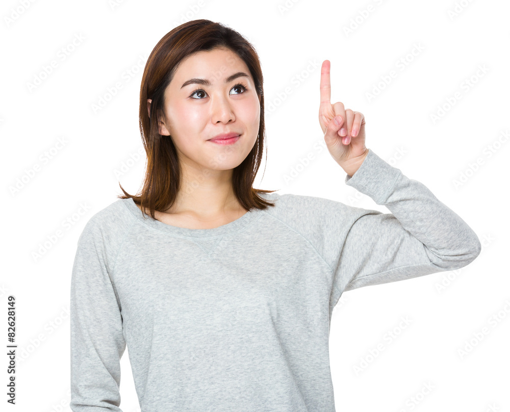 Young woman touch on imaginary button Young woman touch on imaginary button