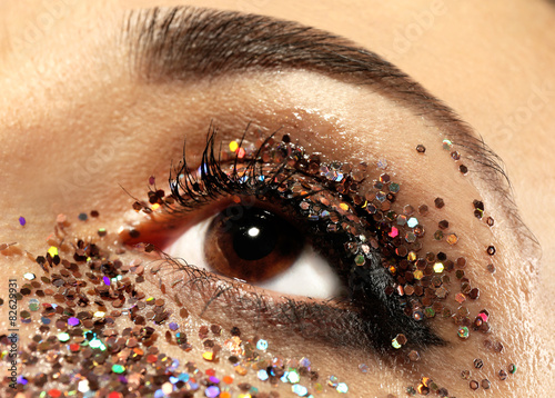 Female eye with fancy glitt...