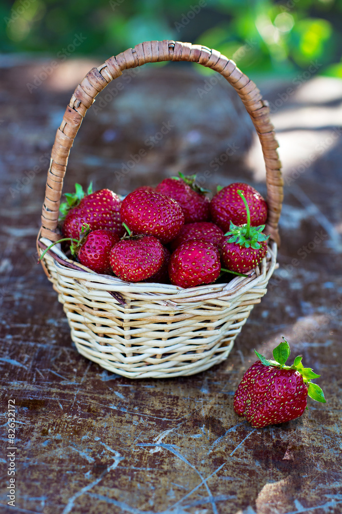 Strawberry is scattered out of the bucket on the table Strawberry is scattered out of the bucket on the table