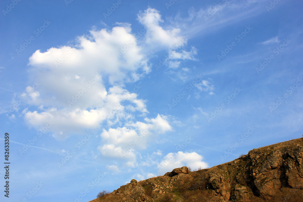 Hill and Blue sky background with clouds