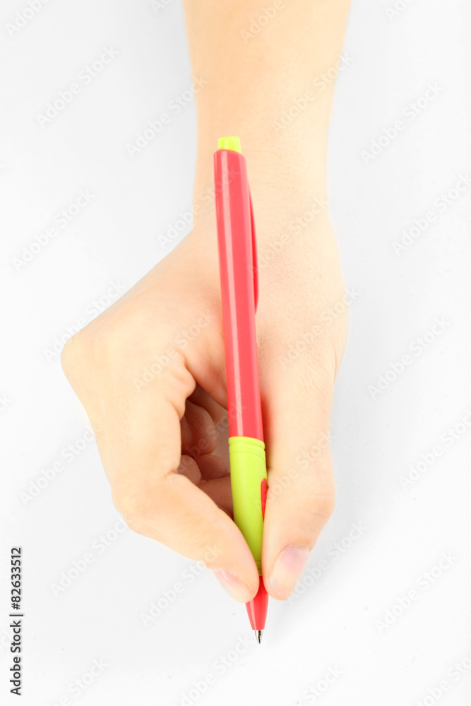Female hand with pen isolated on white Female hand with pen isolated on white