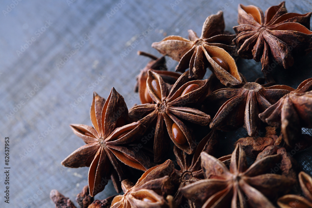 Star anise seeds on the wooden background Star anise seeds on the wooden background