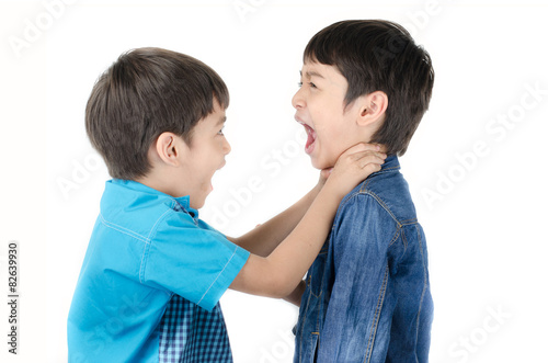 Little sibling boy fighting on white background photo