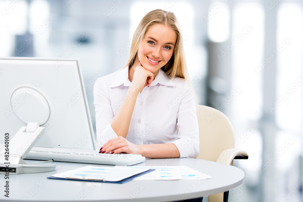 Young business woman using computer at office Young business woman using computer at office