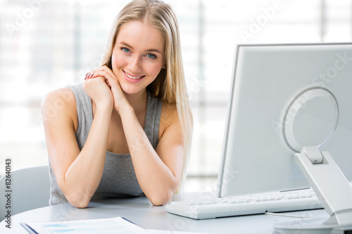 Young business woman using computer at office