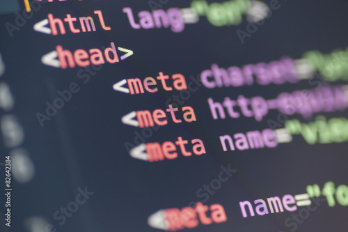 HTML meta tag code on computer screen photo