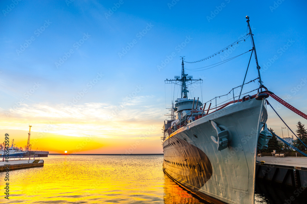 Naklejka premium Warship at sunrise in the port of Gdynia, Poland. 