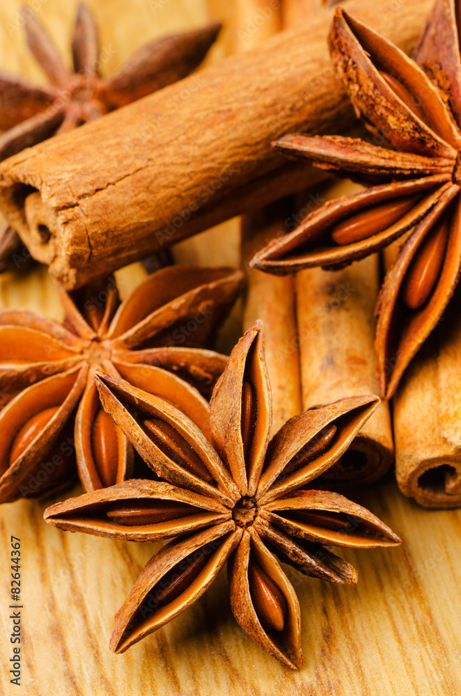 cinnamon and anise on the wooden background cinnamon and anise on the wooden background