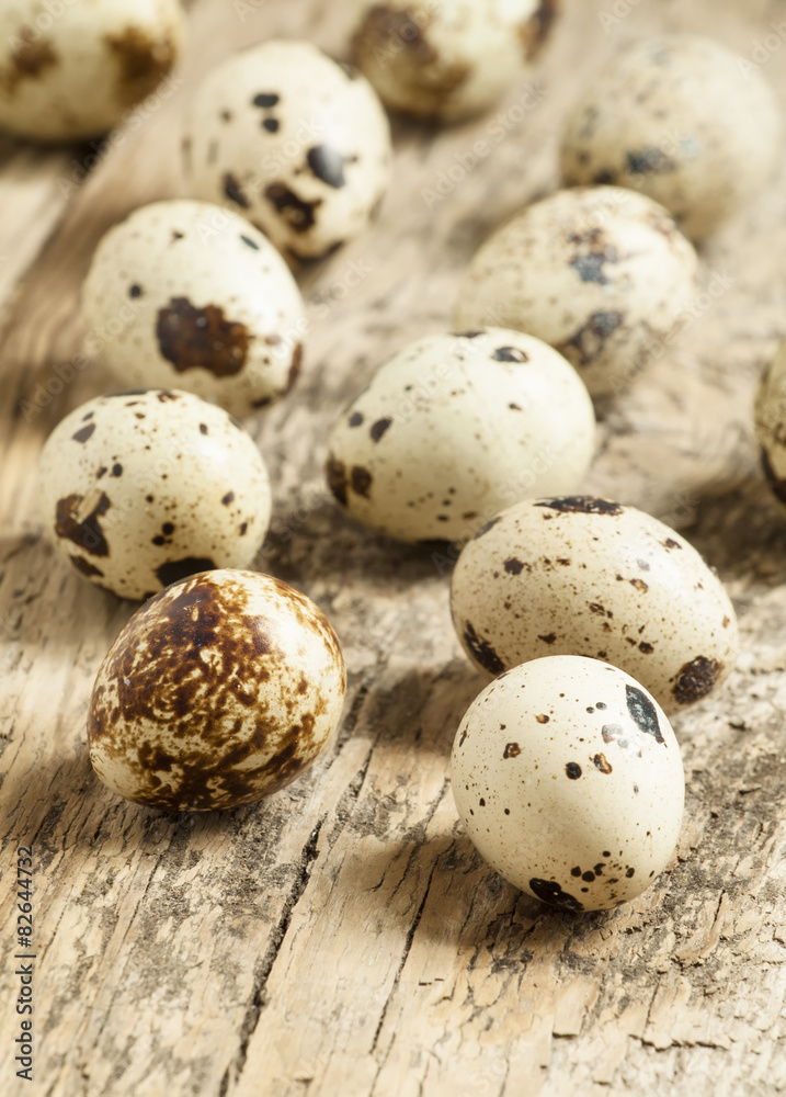 Quail eggs on a wooden table, selective focus Quail eggs on a wooden table, selective focus