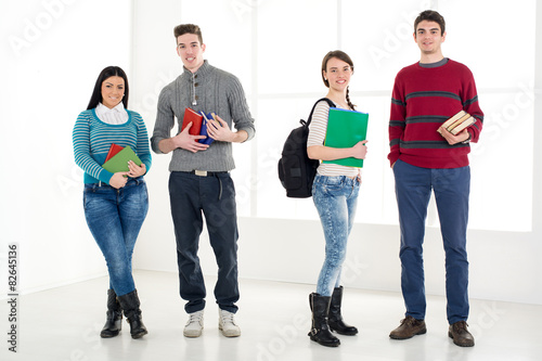 Group Of Smiling Students With Books