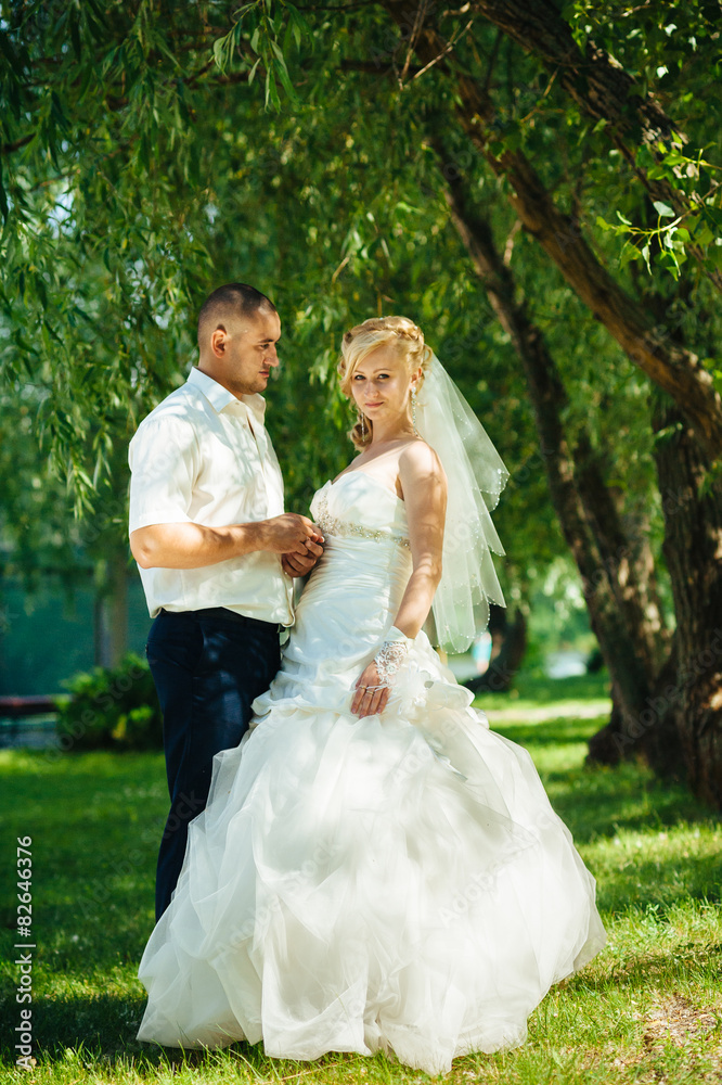 Bride and Groom at wedding Day walking Outdoors on spring nature