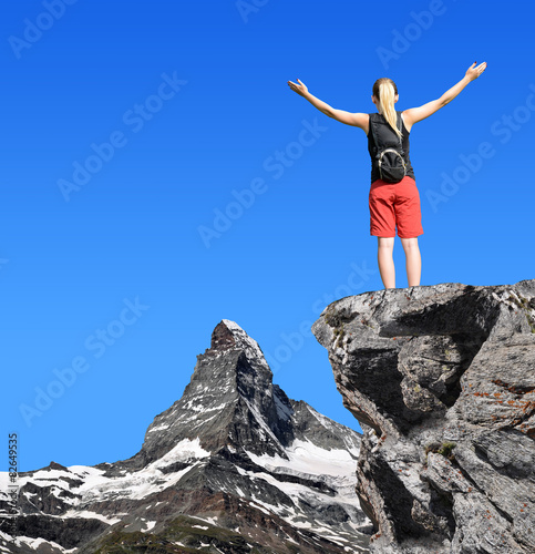 Girl on the top, in the background mountain Matterhorn