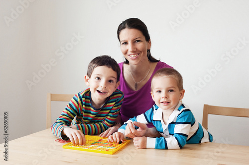 Happy family playing a board game
