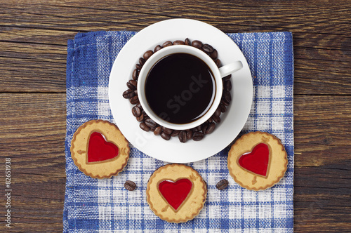 Cup of black coffee and cookies