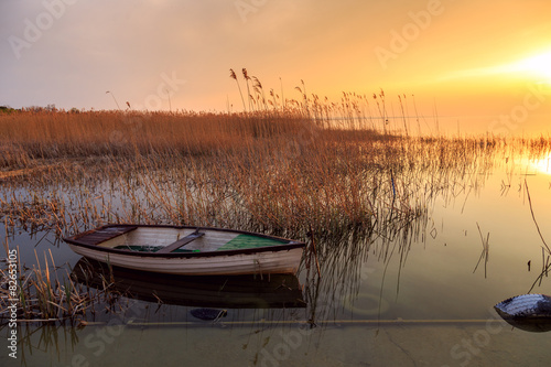 Sunset on the lake Balaton with a boat