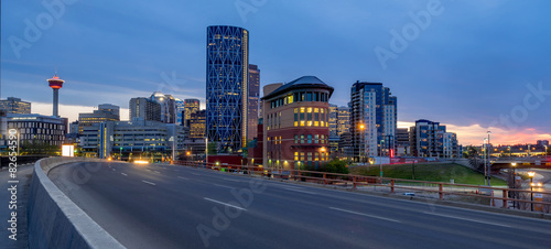 Calgary skyline at night with Bow River and freeway.