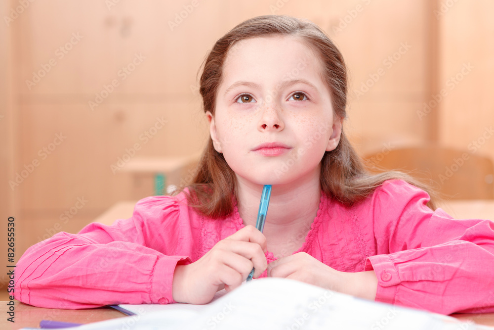 Thoughtful little girl during classes Thoughtful little girl during classes