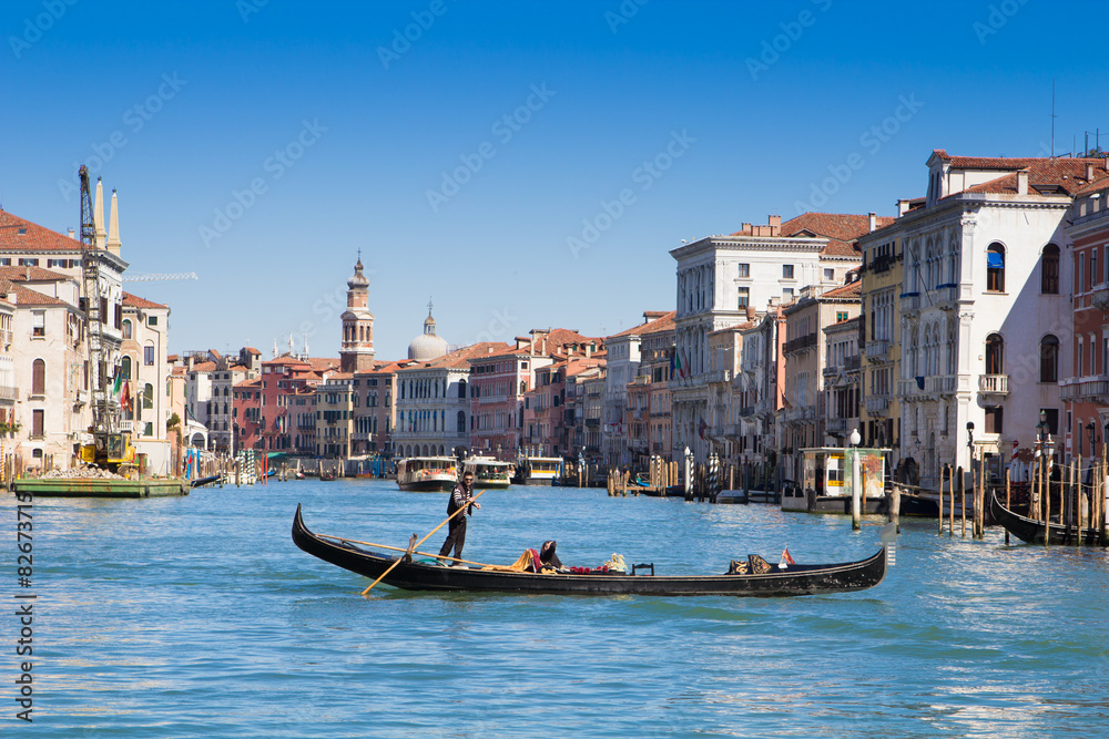 Venice, Italy - March 28,  2015: Gondolier on grand canal