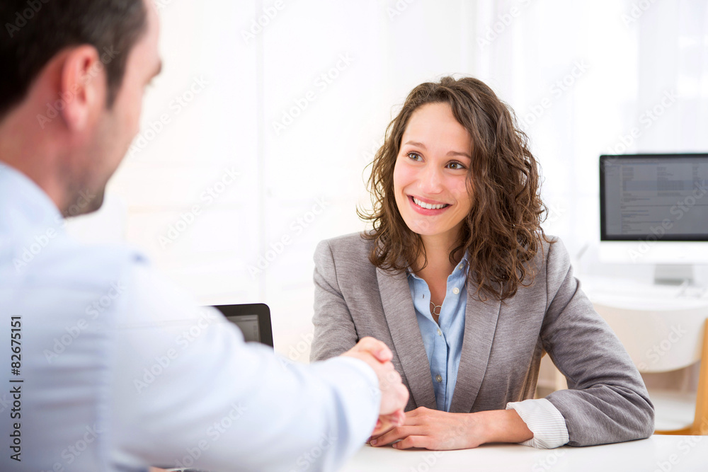 Young attractive woman during job interview - obrazy, fototapety, plakaty 