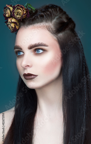 Fototapeta Naklejka Na Ścianę i Meble -  Portrait of beautiful woman with gothic make up.