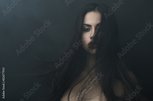 mysterious portrait of a girl in  dark  fog