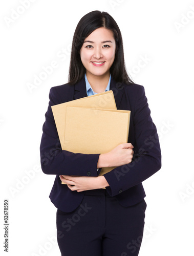 Businesswoman carry with many folder © leungchopan