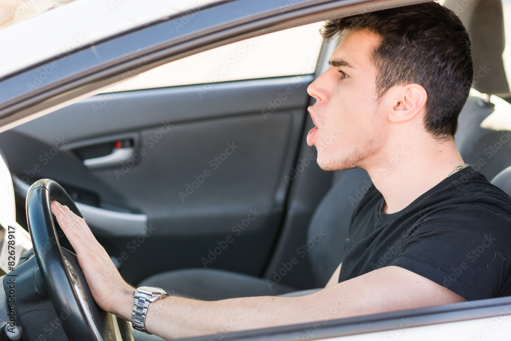 Man pressing horn while in a traffic jam