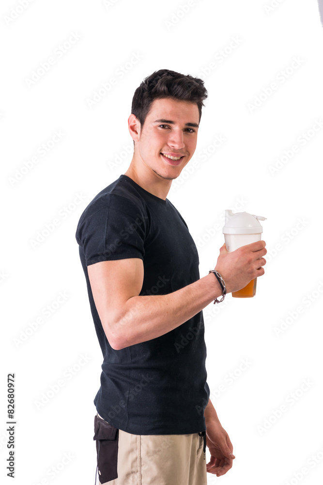 Attractive young man holding protein shake bottle Attractive young man holding protein shake bottle