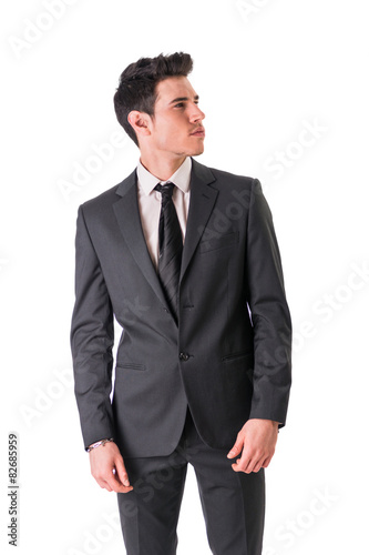Young businessman confidently posing isolated on white
