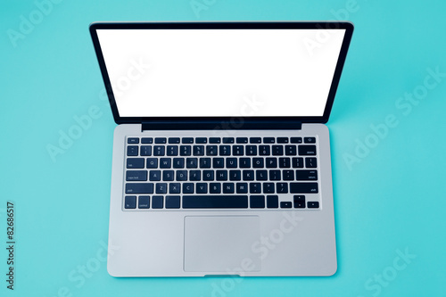 Laptop with white blank screen over blue background