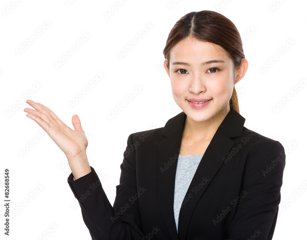 Young businesswoman with hand showing something Young businesswoman with hand showing something