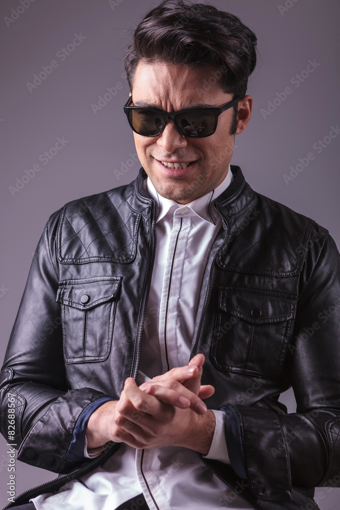 Obraz premium Young fashion man making a funny face
