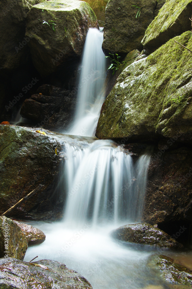 The small waterfall and rocks in forest, thailand The small waterfall and rocks in forest, thailand