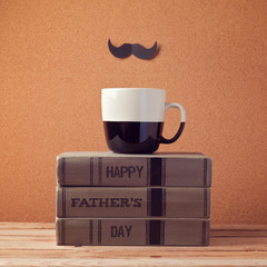 Happy Father's day greeting with cup and books