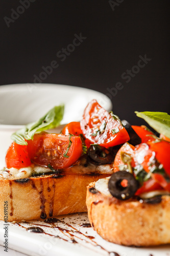 Bruschetta with tomato, mozarella and basil