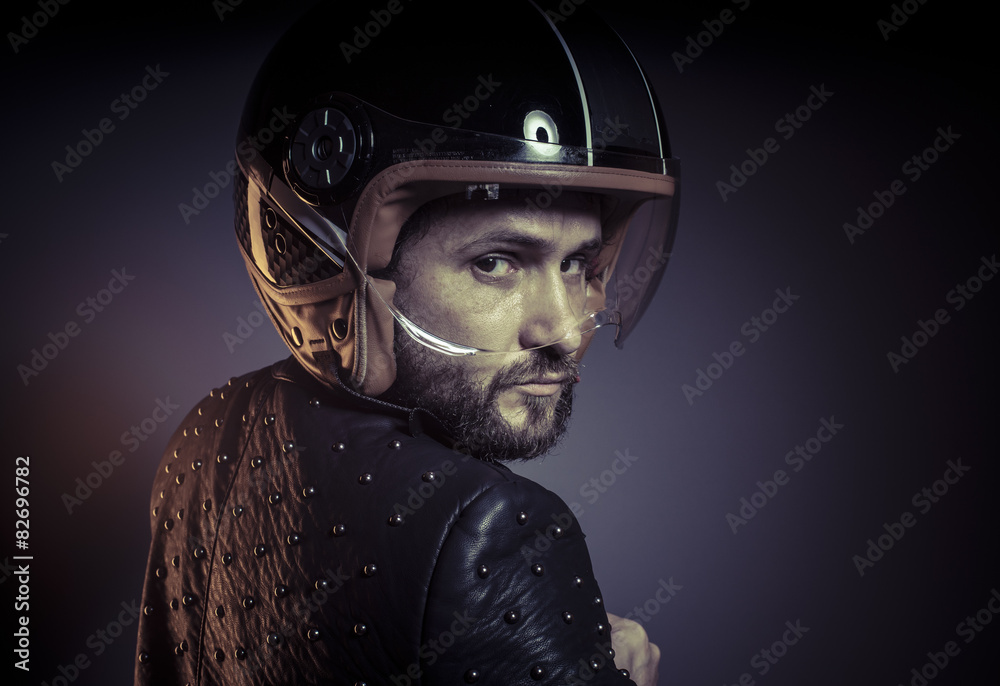 biker with motorcycle helmet and black leather jacket, metal stu biker with motorcycle helmet and black leather jacket, metal stu
