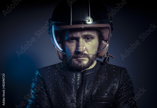 Racer, biker with motorcycle helmet and black leather jacket, me