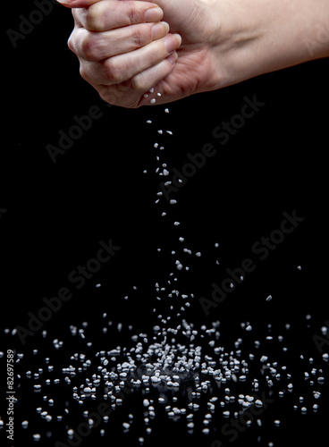 Nib Sugar Dropping from Female Hand