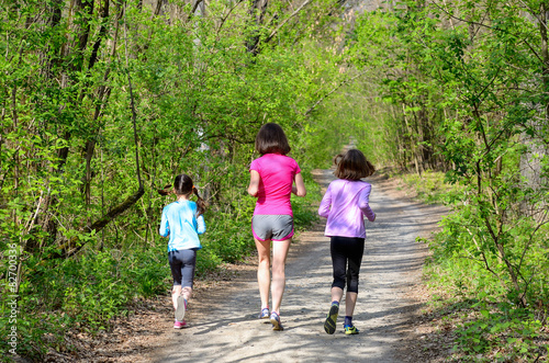 Family sport, happy active mother and kids jogging outdoors © Iuliia Sokolovska