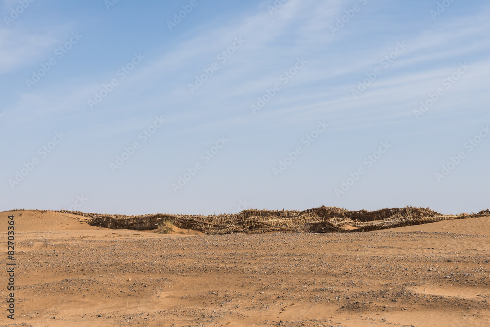 The sand barrier made from straw for Sahara desert