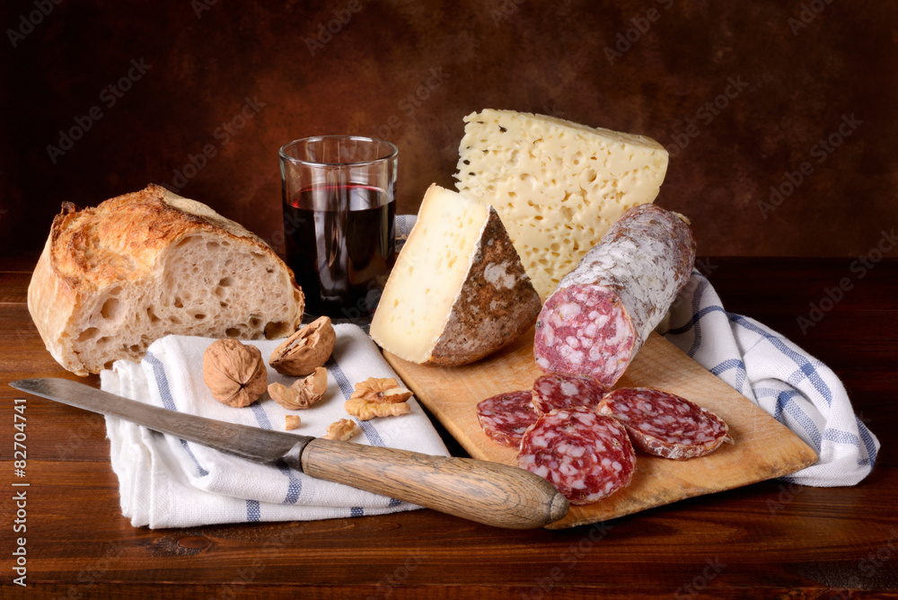 Cheese, salami, bread and red wine
