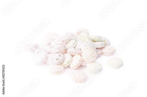 Pile of white breath mint candies isolated